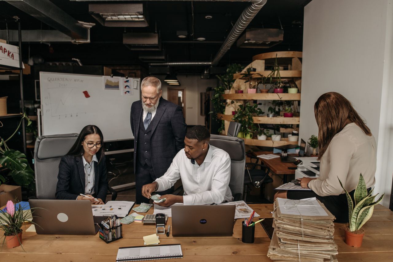 M&A Firm partners in a working session at the office